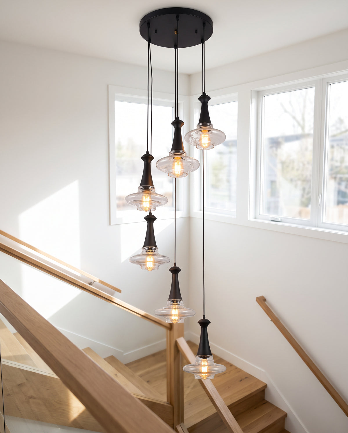 Glass-Disc Spiral Pendant - Matte Black & Clear Glass in a room setting