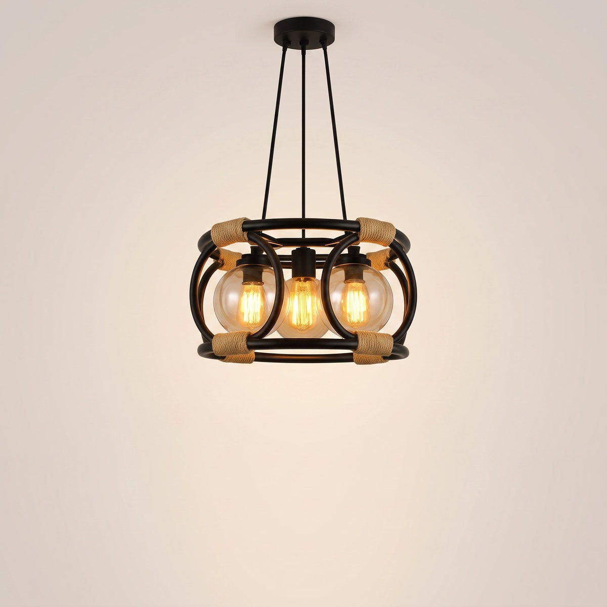 Artisan rope-bound black steel cage pendant with amber filament bulbs