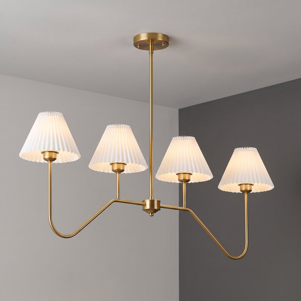 Pleat chandelier with four white pleated shades on a brass frame