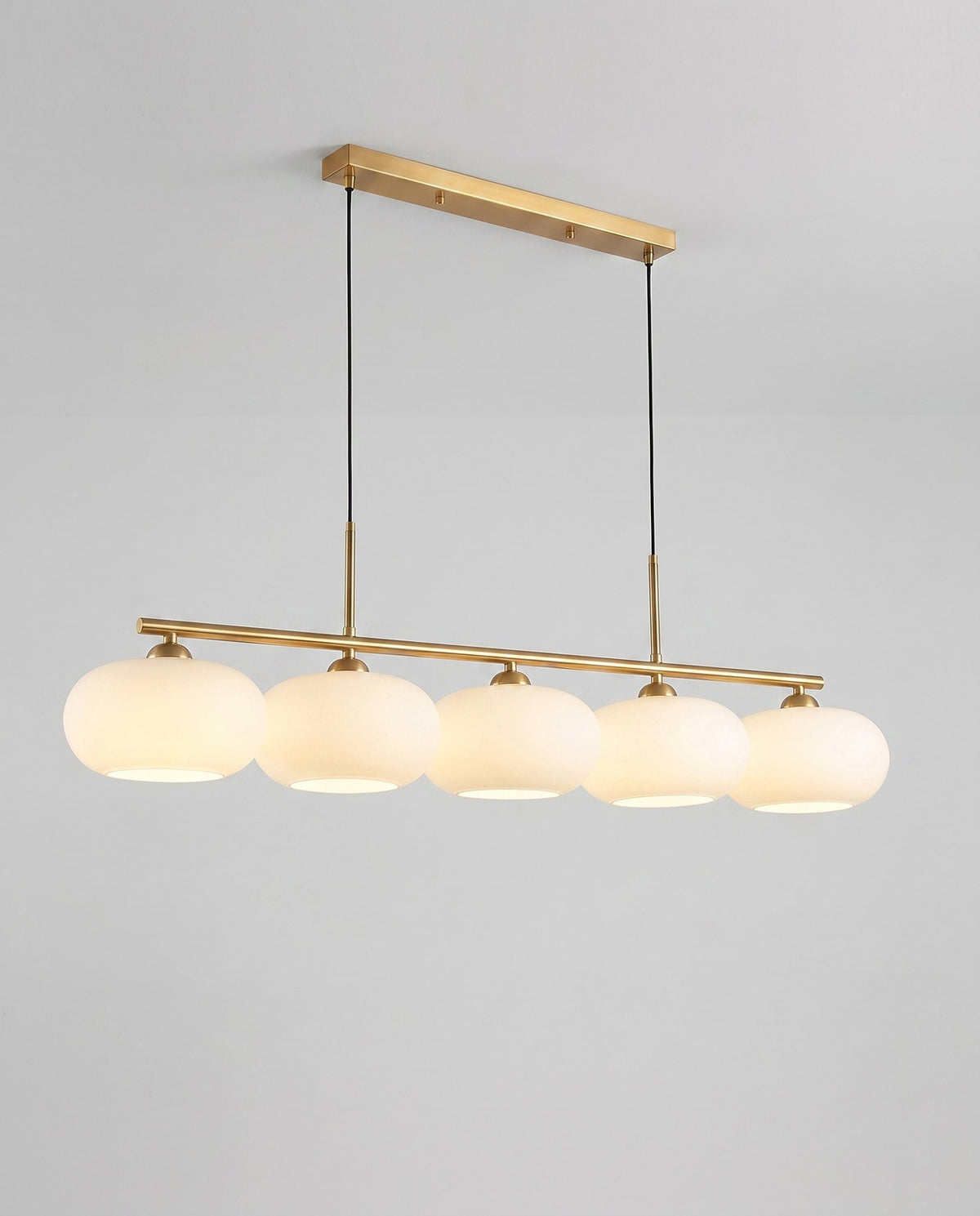 Trio globe island pendant angle view